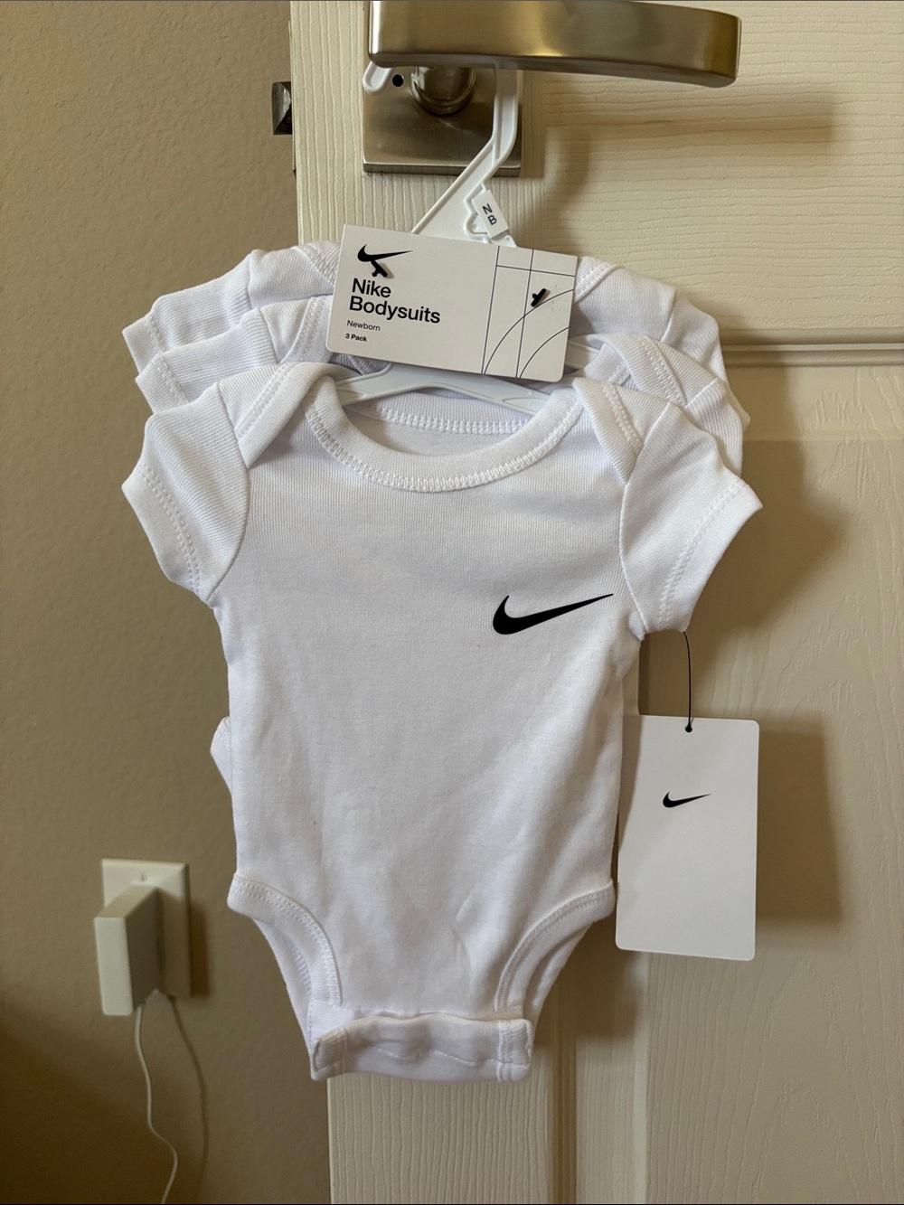 Nike White Infant Bodysuits with Black Swoosh - 3 Pack